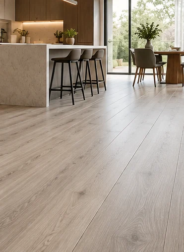 Kitchen and dining area with grey-toned SPC flooring
